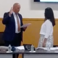 Vanessa Dong-Moncao (R.) was sworn in as the Carle Place Board of Education president, replacing longtime head, Lawrence Zaino.