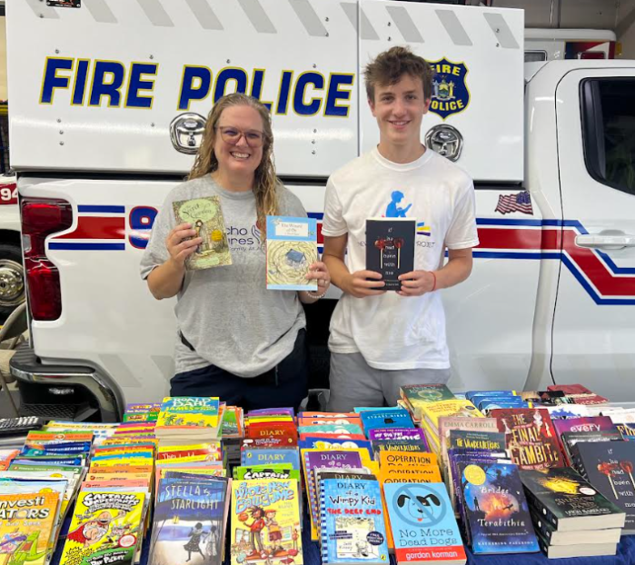 Jericho Cares President Fran O'Connor (L.) and New York Literacy Project Founder Logan Cohen (R.) at last year's back to school drive.