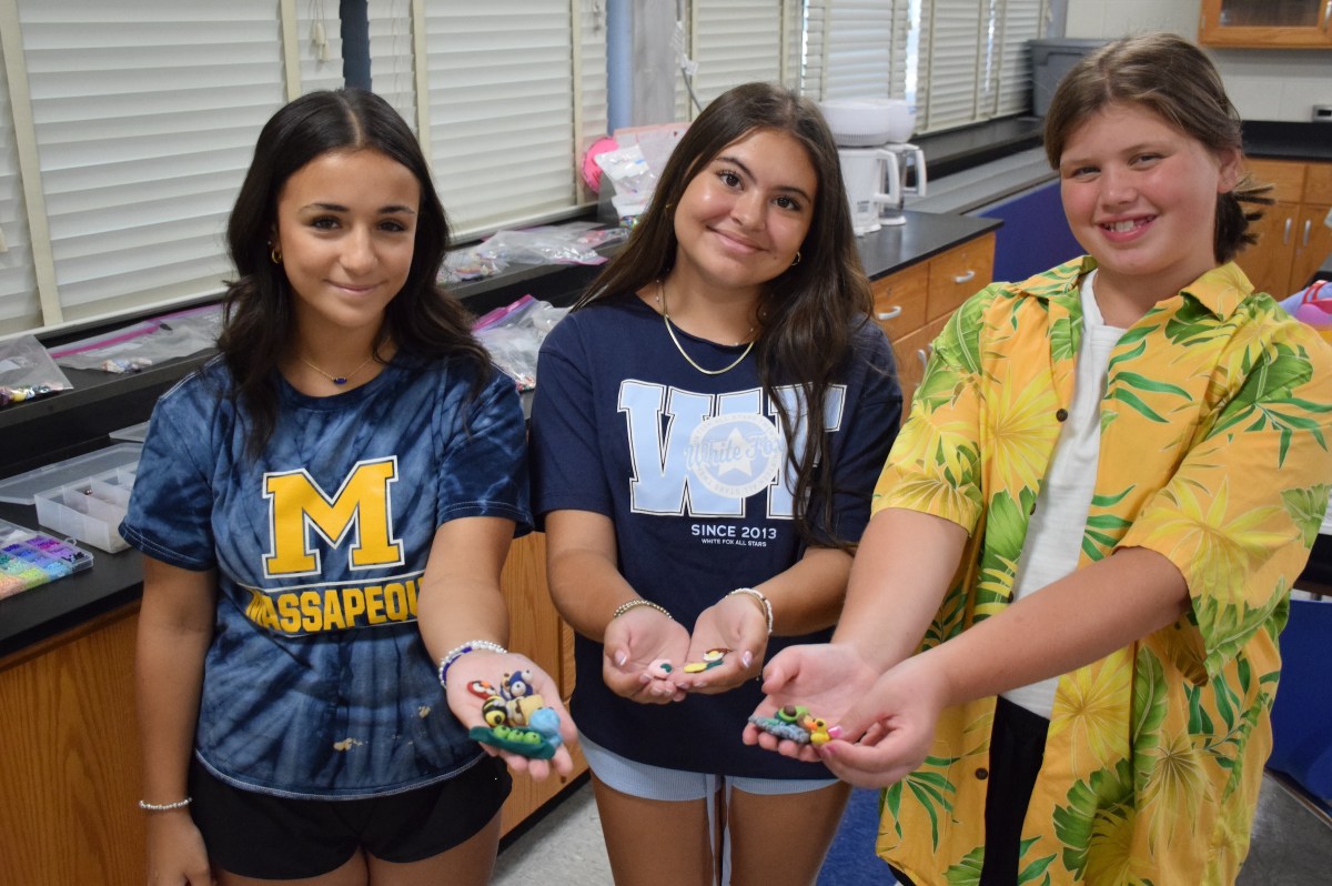 Eva D’Angelo, Eleni Diakoumakis and Madison Cordeau (L. to R.), showed some of the charms they created from clay in the jewelry making class.