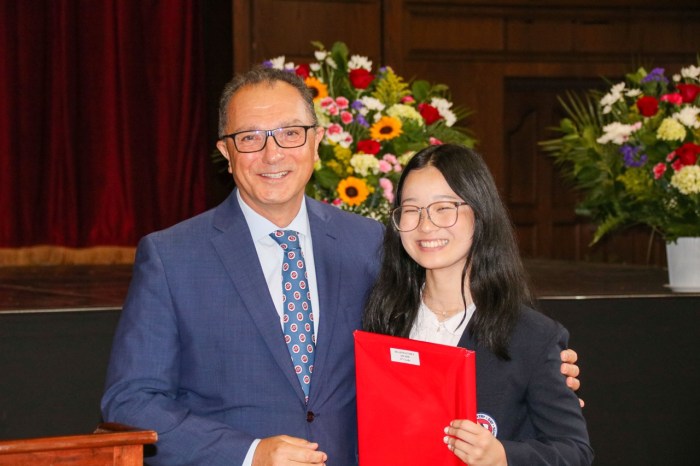 Alyssa Sugiyama took home the Performing Arts & Spanish Awards and is pictured here receiving the Headmaster's Award with Head of School Jean-Marc Juhel.