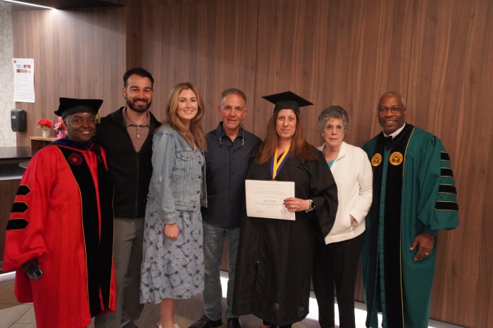 Laura Gallagher with President Timothy Sams and family after receiving the Chancellor’s Award