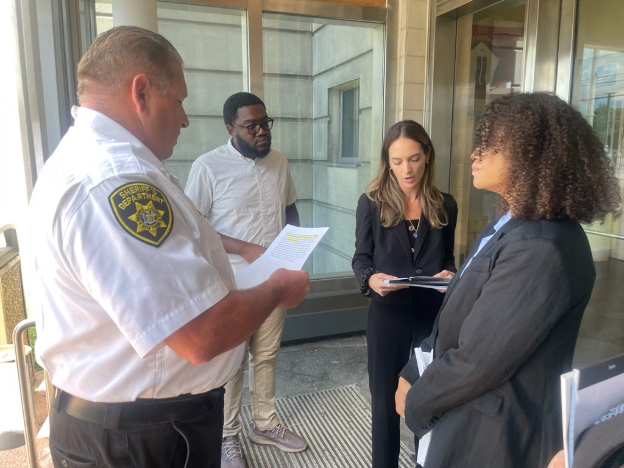 Senator Salazar and Assembly Solages read Section 500-J of the New York State Correction Law to East Meadow Jail facility officials, which permits them to tour the jail at their pleasure.