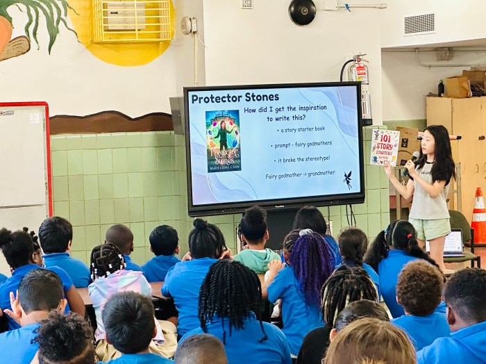 Madeleine Chin presenting to a group of students.