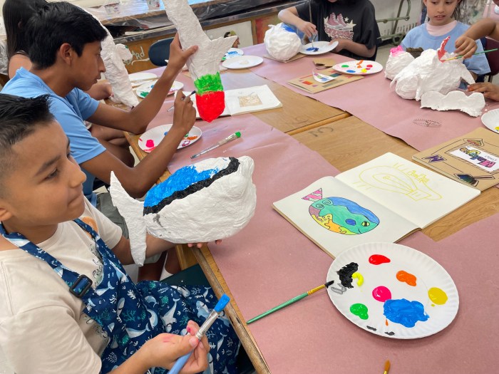 Kids worked on crafting and painting Papier Mâché Fish.