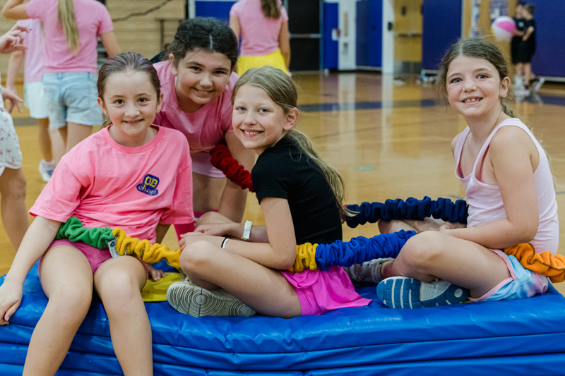 Campers smile as they compete against each other at camp