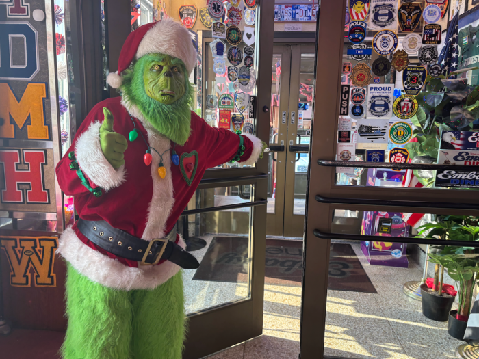 Santa, Mrs. Claus, and the Grinch all took photos with community members.
