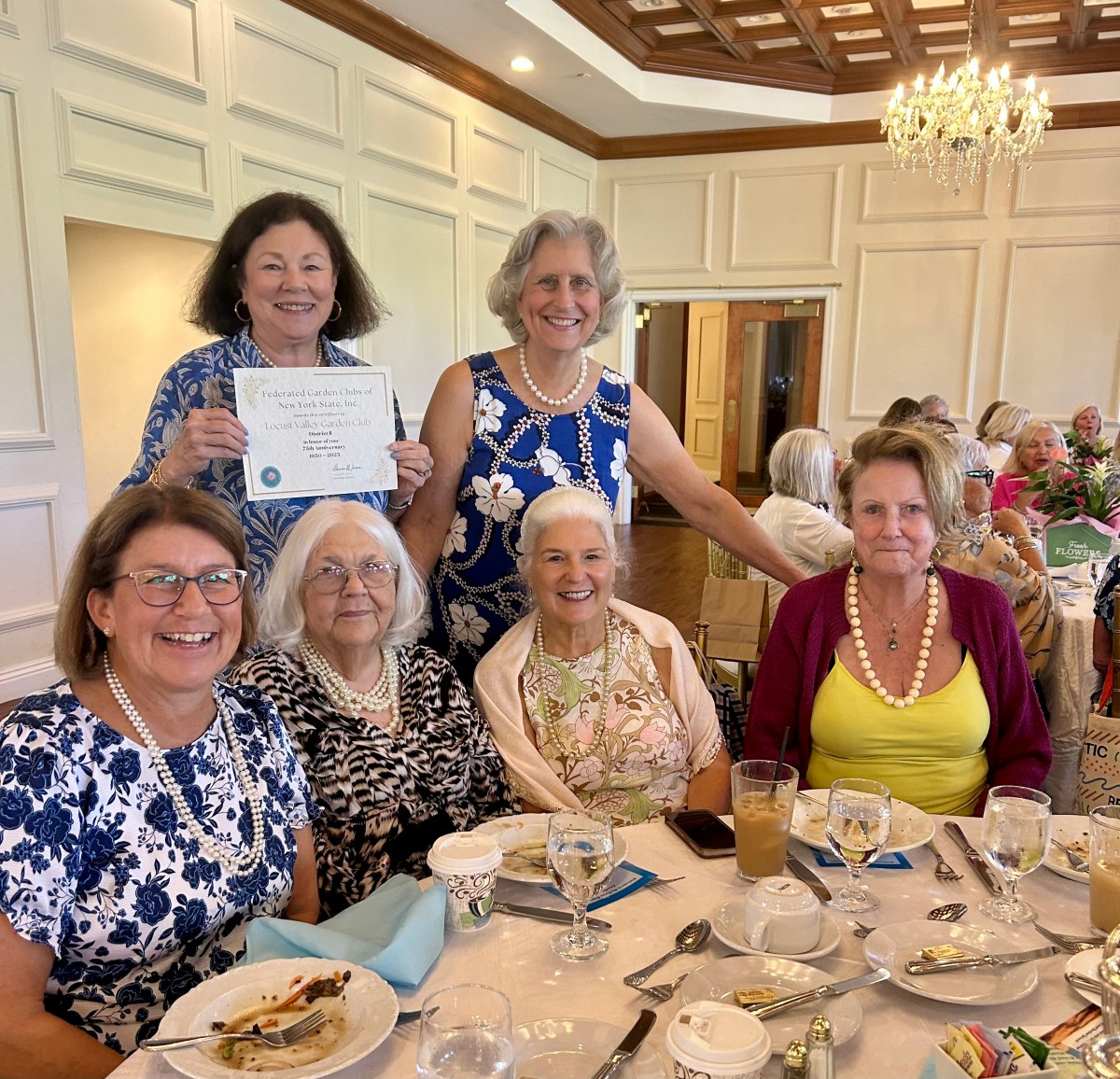 Locust Valley Garden Club members Sallie McNeill Rynd, Allyn Adams (Top L. to R.) and Jane Benstock, Dagmar Karppi, Lucy DeVito and Eileen Keating (Bottom L. to R.) at the Federated Garden Clubs of New York State's July luncheon.
