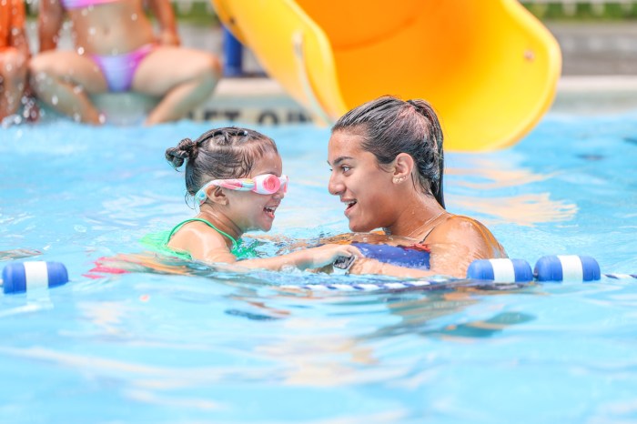 Lifeguards teach instructional swim at camp.