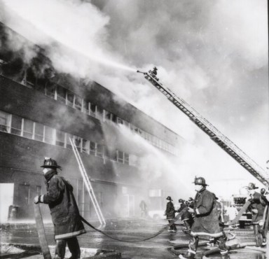 Levittown firefighters putting out a fire at the 3000 building on Hempstead Turnpike.
