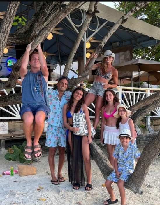 Candie Zar, (hanging on the tree,) and family