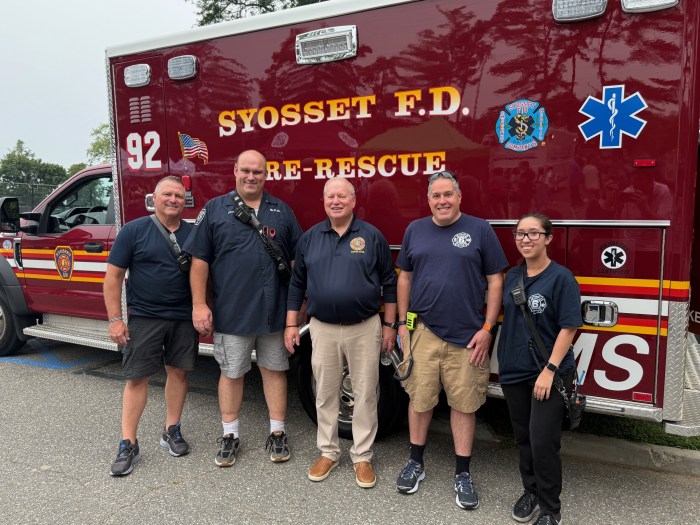 Nassau County legislature Minority Leader Arnold Drucker (C.) with the Syosset Fire Department.