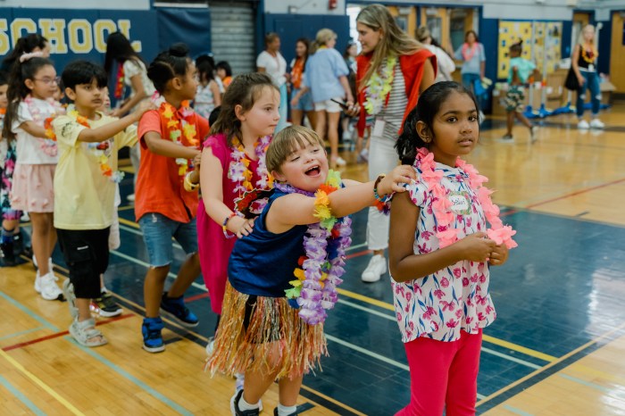 A DJ played tunes in the gymnasium, leading the ESY students in dancessuch as the hokey pokey and conga line.