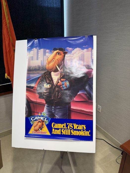 An advertisement for Camel on display at the press conference.
