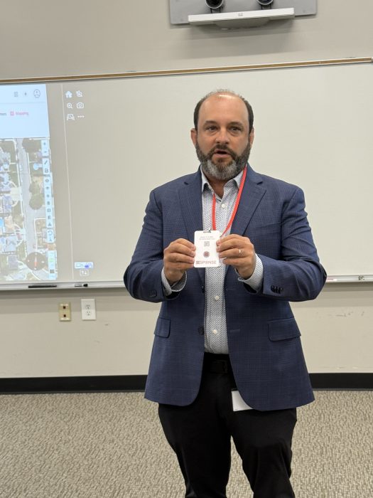 CEO of XSponse Lee Mandel showed the badges each staff member will wear.