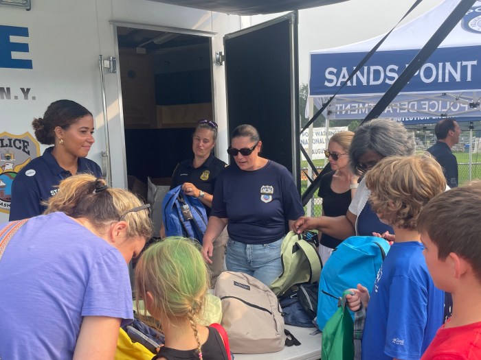 The Port Washington Police Department handed out backpacks with supplies for the upcoming school year.