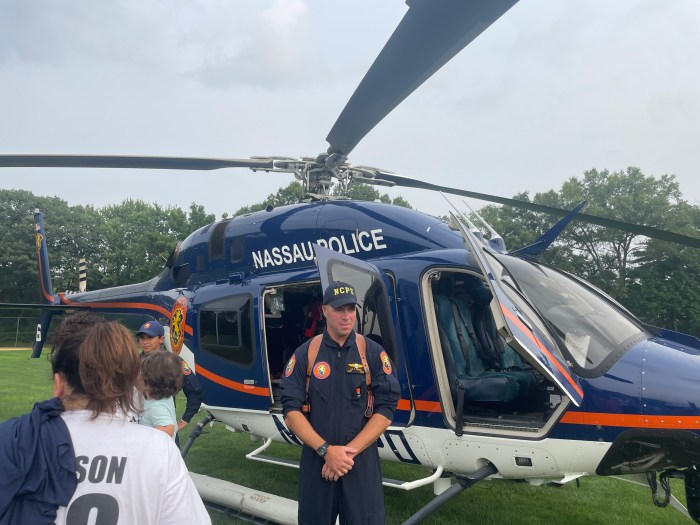 A Nassau County Police Helicopter made a grand entrance, landing on Lion's Field.