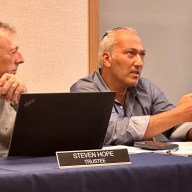Village of Great Neck Mayor Pedram Bral (R.) speaks to a construction representative about the village hall project.