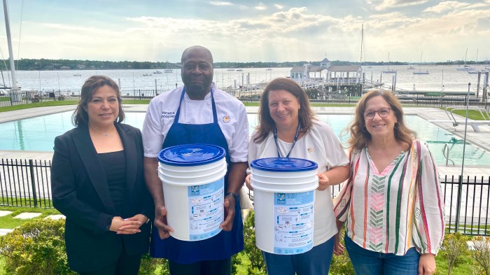 Town Council Member Mariann Dalimonte, volunteer Claire Brezel, and the manager and chef of Manhasset Bay Yacht Club participate in the town’s oyster shell recycling and gardening program.
