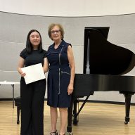 Ruth Pleines (R.) with Weber Middle School student Morgan Sim (L.) who performed at the 2025 Student Recital hosted by the Association of Piano Teachers of Long Island.
