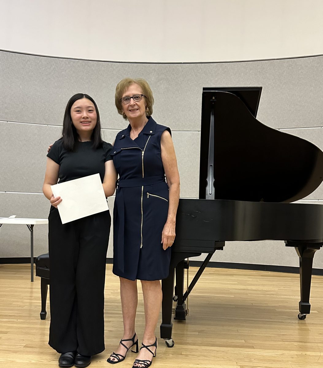 Ruth Pleines (R.) with Weber Middle School student Morgan Sim (L.) who performed at the 2025 Student Recital hosted by the Association of Piano Teachers of Long Island.