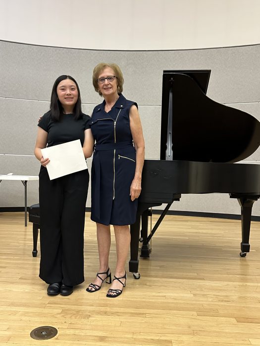 Ruth Pleines (R.) with Weber Middle School student Morgan Sim (L.) who performed at the 2025 Student Recital hosted by the Association of Piano Teachers of Long Island.