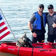 Derick and Owen Valance (L. to R.) arrive in Port Jefferson after completing last year’s 22-mile kayak crossing of the Long Island Sound.