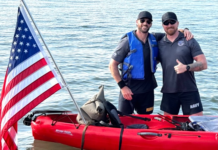 Derick and Owen Valance (L. to R.) arrive in Port Jefferson after completing last year’s 22-mile kayak crossing of the Long Island Sound.