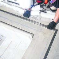 An Infinity Drain custom pool drain being installed.