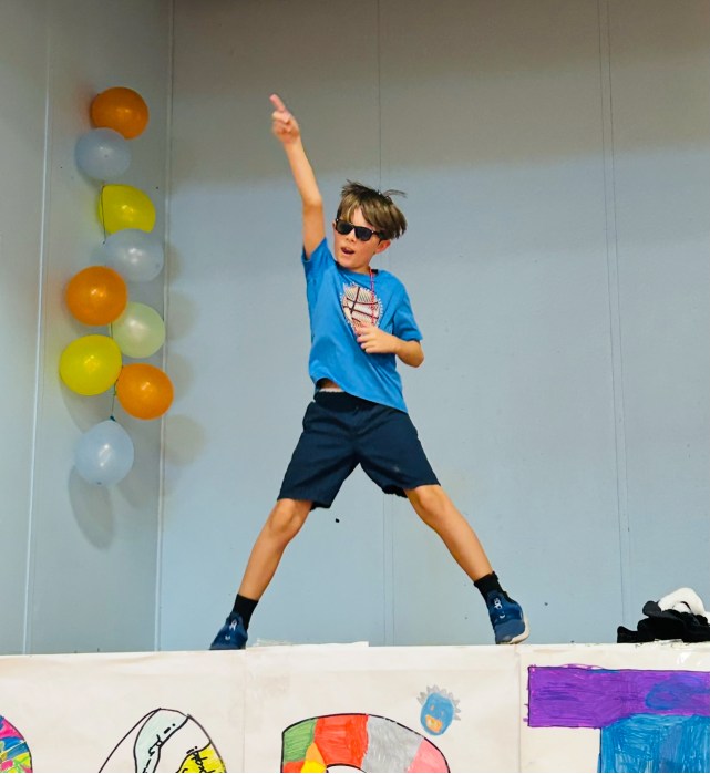 Children sang and danced across the stage fort their loved ones.