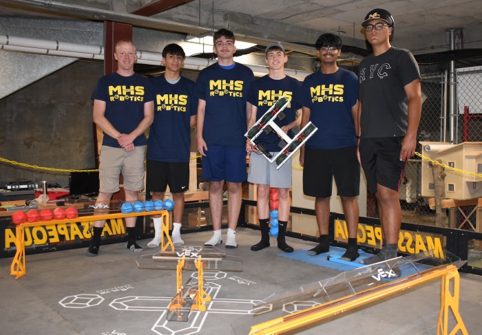 Technology teacher Matthew Swanson and high school Robotics Team members Ethan Simon, Thomas Flynn, Caiden Kacharaba, Dylan Raghubeer and Robert Meilak (L. to R.) at Massapequa's robotics camp