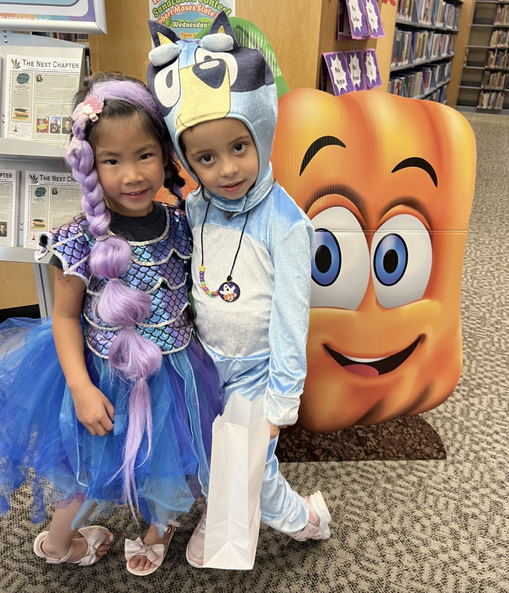 Kids trick-or-treat at Syosset's first 'Summerween' celebration.