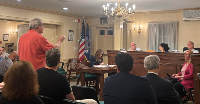 A resident speaks during the public hearing for the condominium proposed at 200 Middle Neck Road in Great Neck Estates.