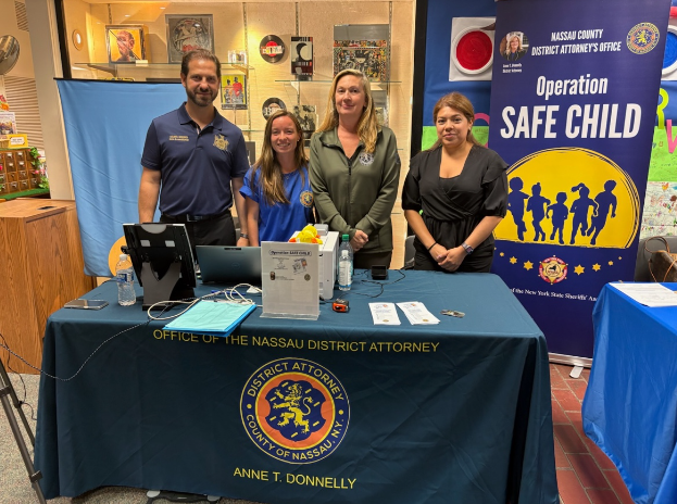 Assembly Member Daniel Norber (L.) in conjunction with Sen. Jack Martins hosted operation safe child at the Bryant Library.