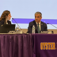 Oyster Bay-East Norwich Superintendent Francesco Ianni (R.) tells resident Ann Marie Longo that his goals are "internal."