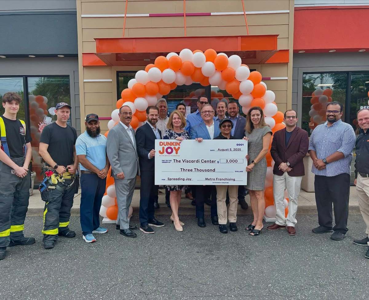 Dunkin in Roslyn Heights reopened with a donation from Metro Franchising, with Nassau County officials joining the celebration.