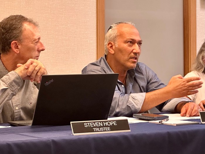 Village of Great Neck Mayor Pedram Bral (R.) speaks to a construction representative about the village hall project.