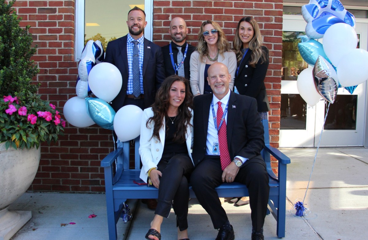 Sitting (L.) to (R.): Roslyn Middle School co-president Jocelyn Wasserman, Roslyn Middle School principal Craig Johanson.