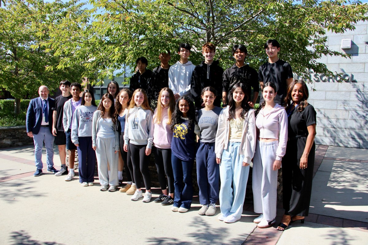 Roslyn High School principal Dave Lazarus and Director of Guidance and Counseling Tanya Baptiste with the 2026 National Merit Scholarship Program Commended Students.