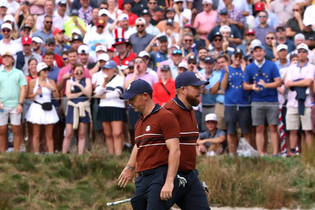 Bethpage Black Golf Course, Farmingdale, New York, United States – September 27, 2025 Team Europe’s Rory McIlroy and Shane Lowry react on the 6th hole during the four-balls as fans cheer