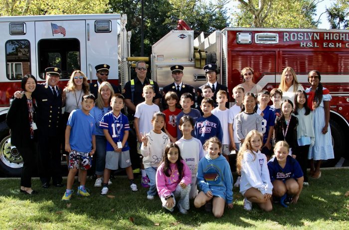 Superintendent Allison Brown, Assistant Superintendent Karina Baez, East Hills Principal Sherry Ma and East Hills Assistant Principal Jennifer Sheehan with students and members of the Roslyn Highland Fire Department.