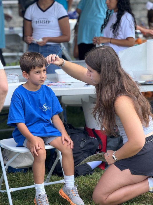 Kids could get their face painted by the arts and crafts tent.