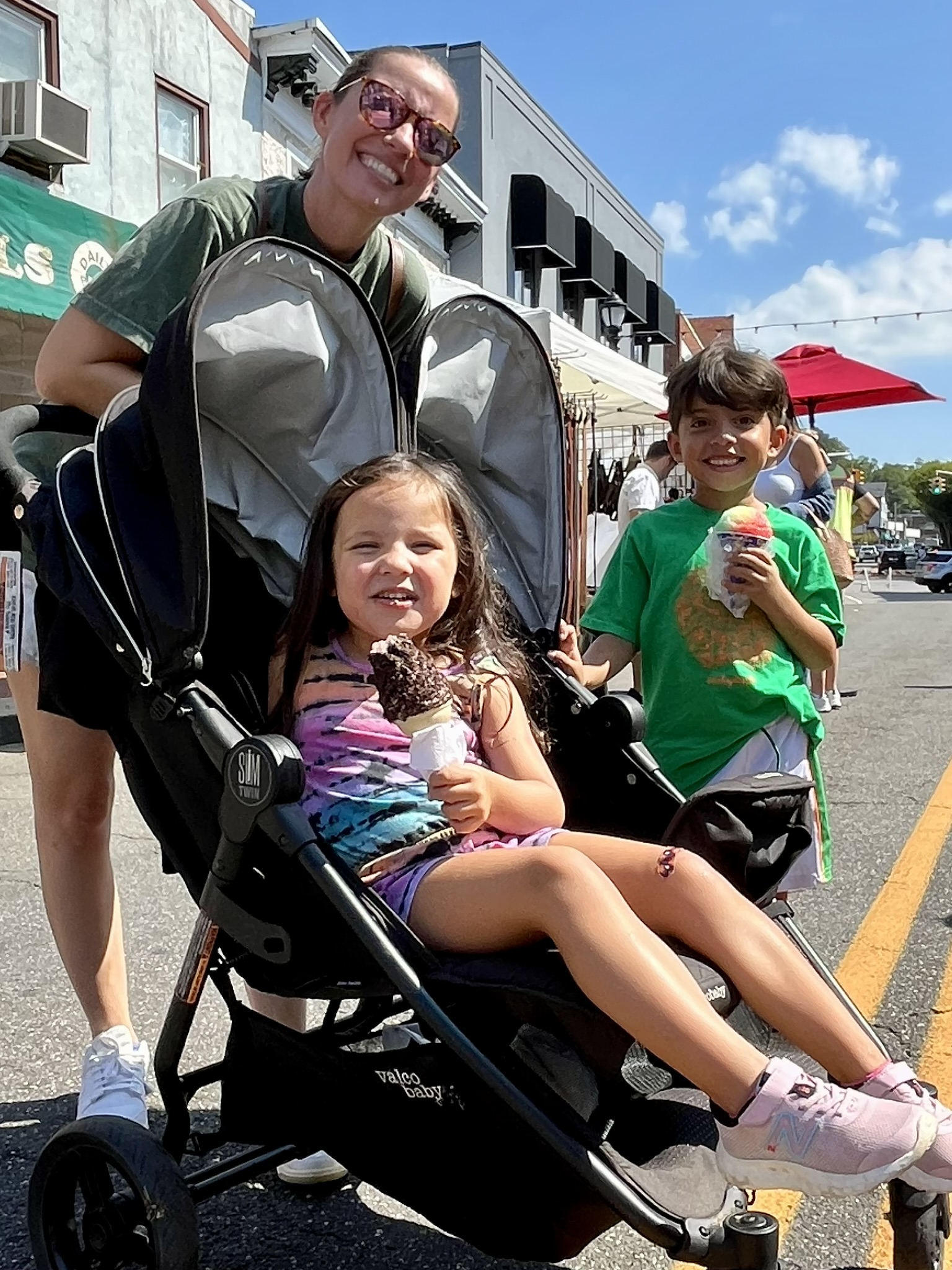 Children and adults enjoy dessert at the Glen Cove Street Fair.