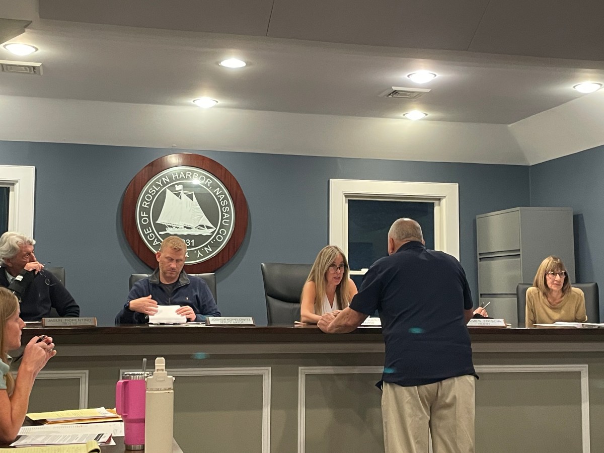 Richard Tocci, representing the Roslyn Highlands Fire Company, addresses the Roslyn Harbor Board of Trustees about proposed increases to volunteer firefighter pension benefits.