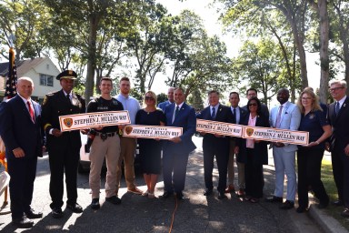 A street renaming was held in Massapequa for a former Suffolk County Police Officer who died from cancer attributed to his work in Manhattan after the Sept. 11 terrorist attacks.