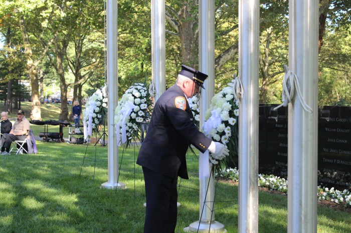 Police and Firefighters presented wreaths in front of the memorial.