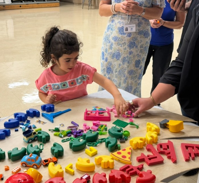 Children visit the Sid Jacobson JCC in Roslyn to assist with the Wings of Hope project, which will be displayed at the center on Oct. 7.