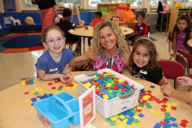 Kindergartners with their teacher Ms. Roberts at Guggenheim Elementary on the first day back to school for the 2025-26 school year.