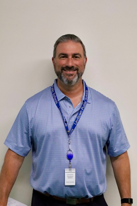 John Coscia was promoted to be the district's new director of health, athletics and physical education.