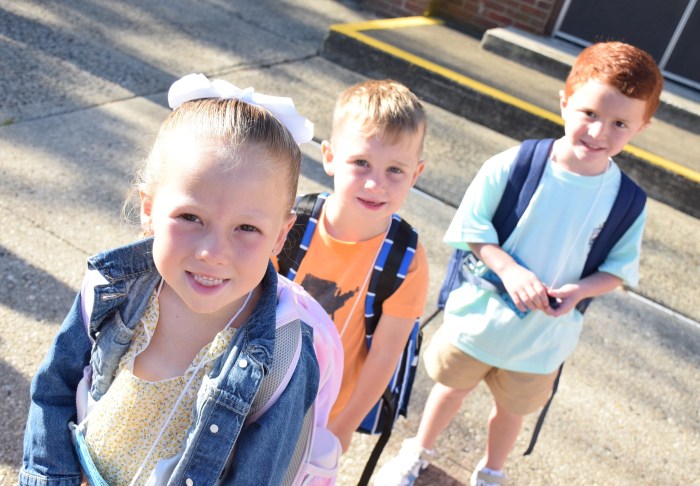 Addison Korrow, William Liebman and Leonardo Spennato (L. to R.) waited outside ofEast Lake Elementary School for their first day of school to begin.