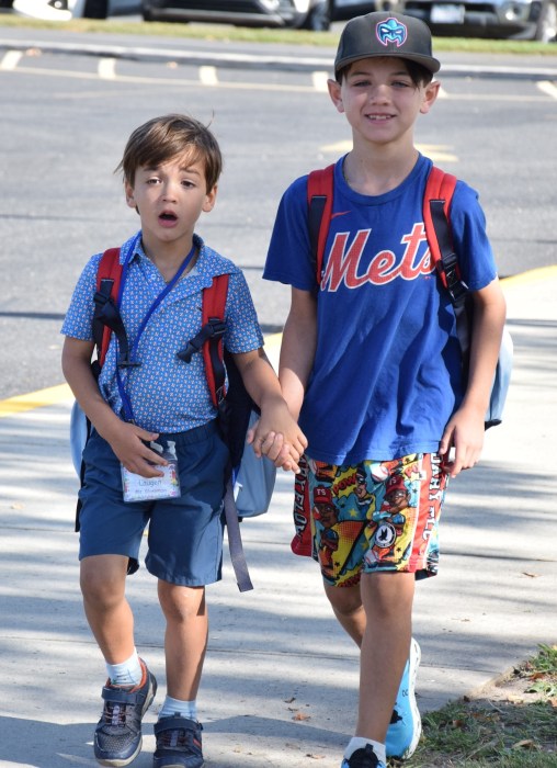 Fourth grader Luca Laugen and his brother Noah walking to Unqua’skindergarten entrance.